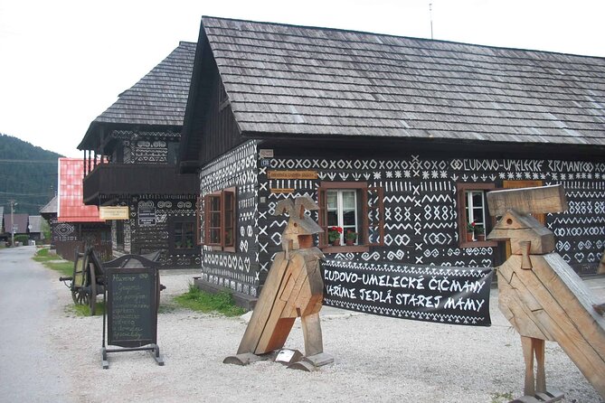 From Bratislava: Cicmany tour with Thermal Bath Entrance - Stop 1, Čičmany: 136 log houses wrapped in white geometry