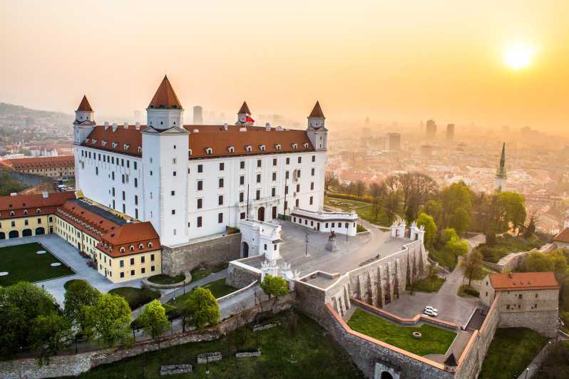 Bratislava Castle above the old town roofs at sunrise